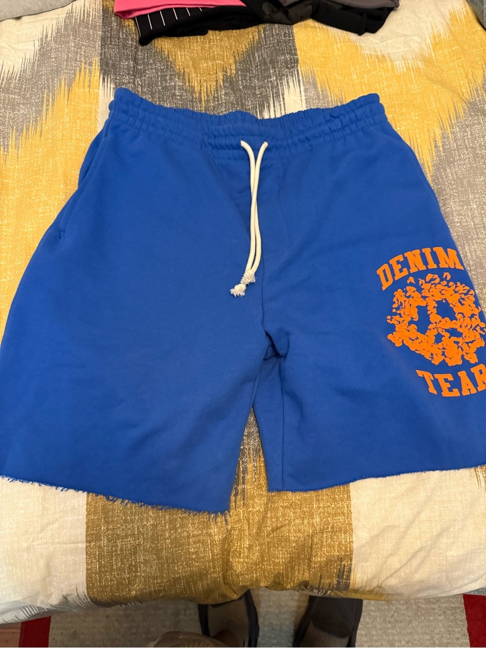 Denim Tears University Blue Athletic Drawstring Shorts with Orange Graphic